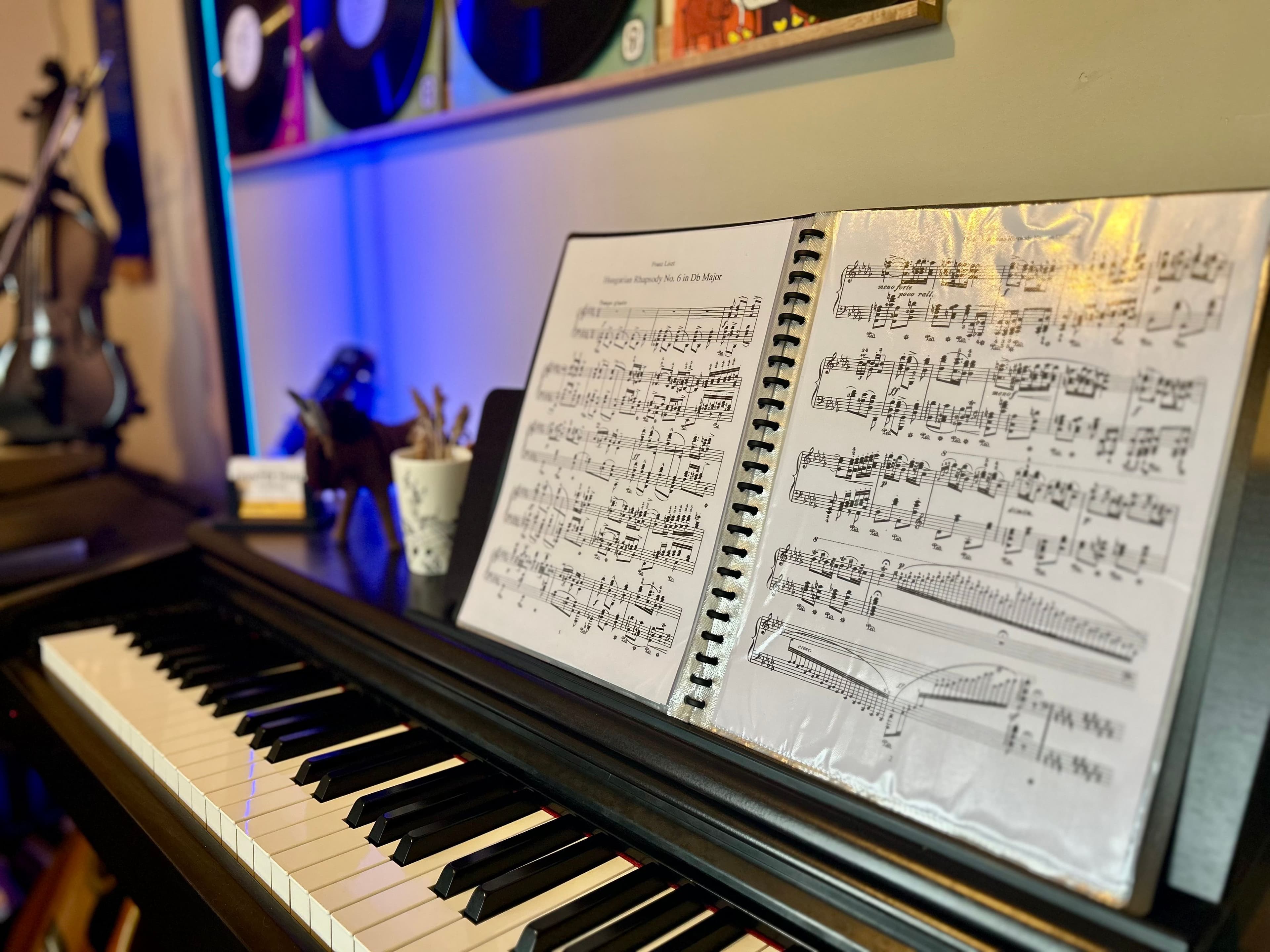 The sheet music of Liszt's Hungarian Rhapsody No. 6 on the piano in the Weston studio